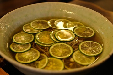 Sudachi is a citrus fruit similar to a lime. This is the buckwheat noodle broth with sudachi. Japanese people like to eat sudachi noodle broth in hot summer
