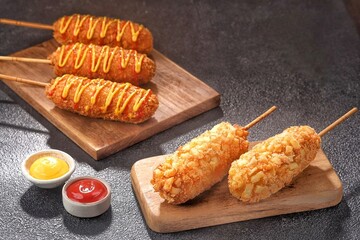 Corn dog is a food made from skewered sausages (usually hot dogs) coated in a thick layer of cornmeal and fried.