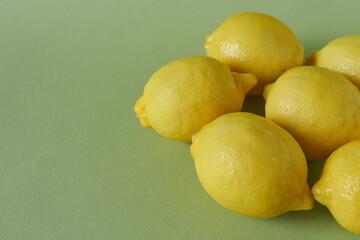 Lemons on a green background. Vitamin C.