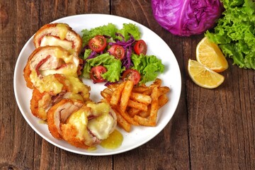 Cordon bleu or schnitzel cordon bleu is a meat dish wrapped in cheese.