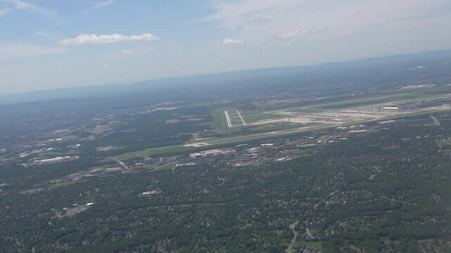 Washington DC, USA  The view from a plane landing at Dulles Airport over Northern Virginia woods, fields, roads, and neighbourhoods. 