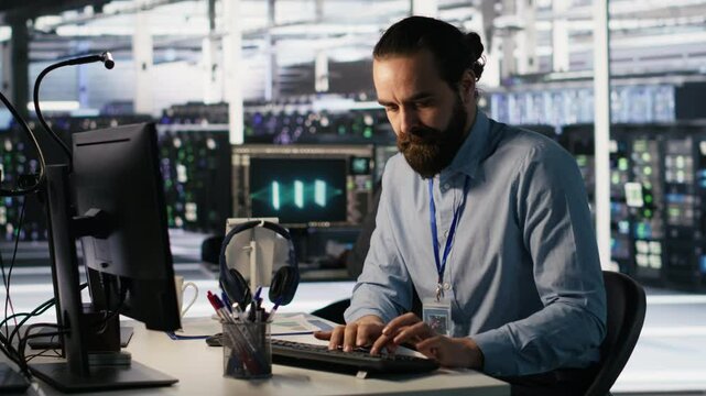 Angry data center engineer banging fist on desk after seeing system failure. Server farm IT expert reacting furiously to unstable infrastructure performance, leaving office, camera A