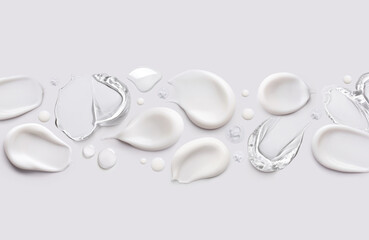 samples of cosmetic care products smear of cream and gel texture on a light background