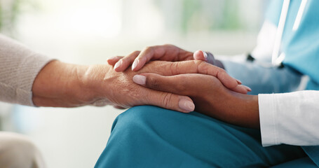 Doctor, holding hands or elderly patient with empathy for comfort, healthcare or consultation at...