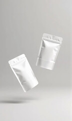 Two white standing pouch on grey studio background, with soft natural lighting. Perfect for eco-friendly packaging and product mockup.