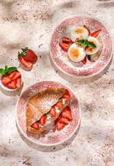 cottage cheese cheesecakes with strawberries, croissant and porridge with strawberries. breakfast in the restaurant