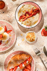 croissant with strawberries and mascarpone and cheesecakes with strawberries