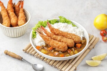 Ebi Fry Curry Don. Crispy and golden panko-crumbed prawns, coated in a thick curry sauce and served with rice,