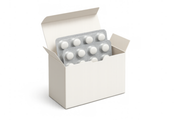 White pills blister packs inside open cardboard box on transparent background
