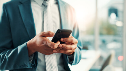 Phone, hands and black man in office with communication, contact or business networking. Connectivity, cellphone and African financial manager with email for finance report with client in workplace.