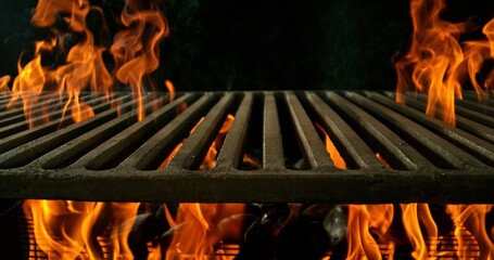 Hot empty portable barbecue BBQ grill with flaming fire and ember charcoal on black background. Waiting for the placement of your food.