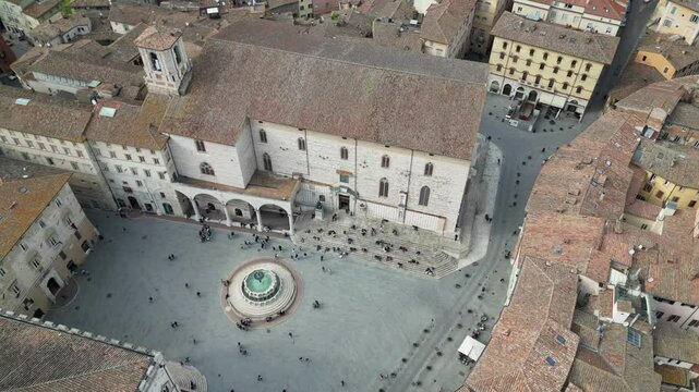 Italy, Umbria, Perugia drone aerial view .The Fontana Maggiore, located in Piazza IV Novembre ( Piazza Grande), is the symbolic monument of the city of Perugia and the roofs of the houses 