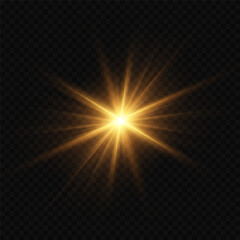 Fototapeta premium Shining golden star light flash with realistic lens flare. On a transparent background