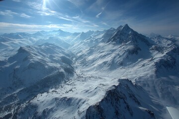 Majestic snow-covered mountains under a bright sky during daytime in a breathtaking landscape
