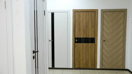 Fototapeta premium Modern interior doors showing different design options in showroom