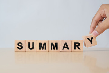 Summary text on wooden cube blocks. Past performance analysis for learning and improvement. Preparation for business plan and strategy development. Meeting, working, project summary report