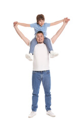 Father and his son having fun together on white background