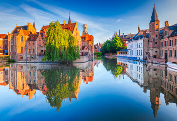 Bruges, Belgium. Rozenhoedkaai in golden hour water canal reflection