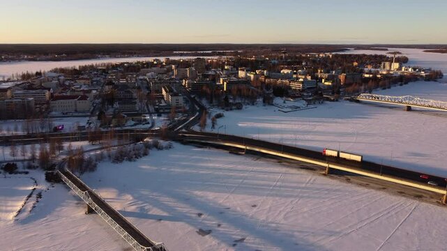 Tornio City next Frozen River Torne, Finnish Lapland, Sunset Aerial
