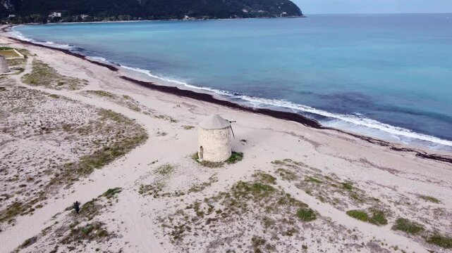 Old Abandoned Wind Mill at the Beach in Lefkada, Greece - Aerial Orbit