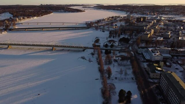 Bridges Over Frozen Snow-Covered River in Tornio Finland AERIAL