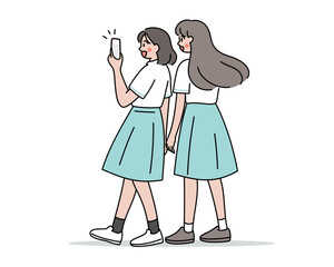 自撮りする女子高生の後ろ姿