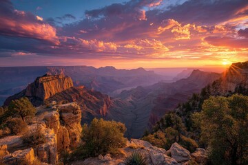 Fototapeta premium Majestic sunset over Grand Canyon showcasing vibrant colors and rugged terrain in late afternoon light