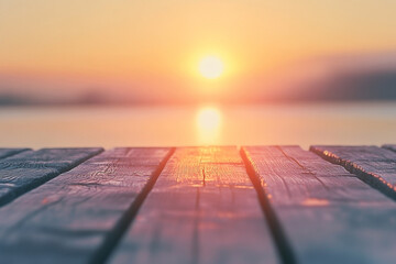 Serene sunset over water viewed from a rustic wooden pier, creating a sense of peacefulness