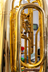 Valves and tubing of a tuba being repaired in a music instrument repair shop