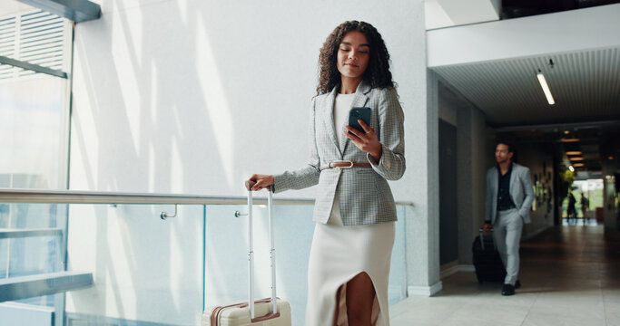 Business woman, travel and phone with suitcase for job opportunity or career trip at airport. Female person, employee or traveler with mobile smartphone or luggage for app, commute or flight delay