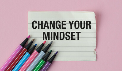 Turn paper and color markers words Change your mindset on pink background