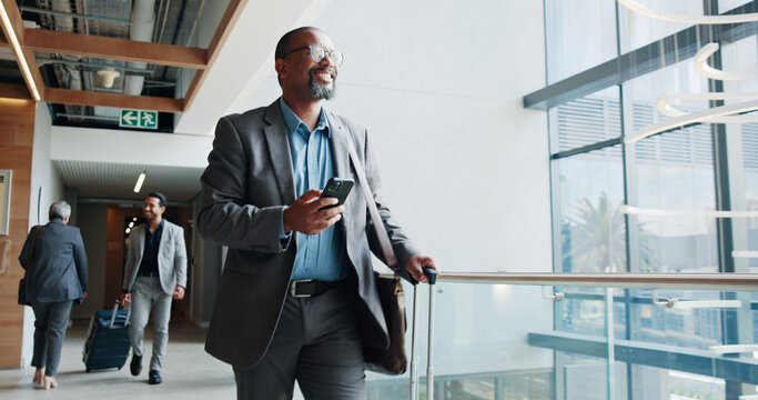 Happy, businessman and walking with phone or suitcase for travel, job opportunity or career trip at airport. Man, employee or traveler with smile, mobile smartphone or luggage for commute or flight