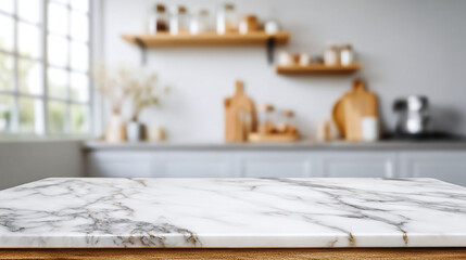 A marble countertop in a bright kitchen with blurred background and wooden shelves on the wall space