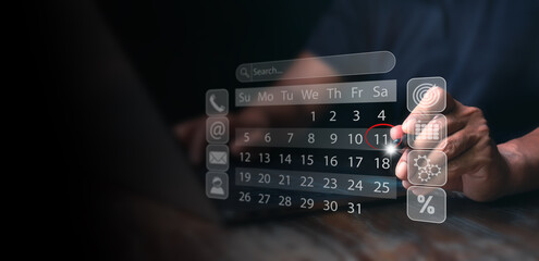 ฺฺBusinessman manages time for effective work. Calendar on the virtual screen interface,...