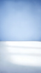 Minimalist backdrop featuring soft gradients of blue and white creating a serene atmosphere