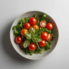 A colorful salad bowl with cherry tomatoes and greens