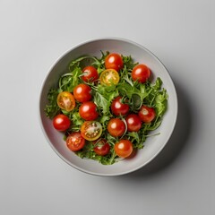 A colorful salad bowl with cherry tomatoes and greens