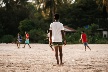 Soccer players on a football pitch in Africa