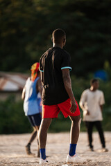 Fototapeta premium Soccer players on a football pitch in Africa