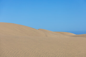 Desert landscape and sand dunes in Maspalomas. View of dunes and sea. Gran Canaria Island Spain