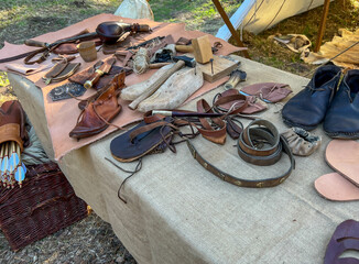 A saddler's workshop, a stand showing the production of leather goods using old methods