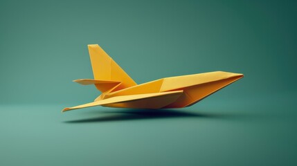 Close-up of a yellow origami airplane against a teal background.