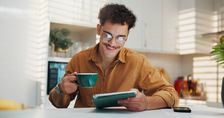 Home, coffee and man with tablet, smile and online reading with morning news, email and internet. Happy, tech and person in kitchen, connection and herbal tea with social media, digital app and latte