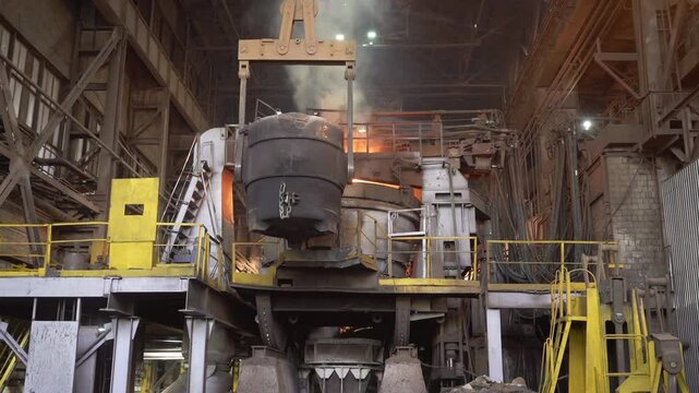 Molten metal pouring in steel mill: industrial manufacturing process. Stock clip