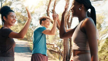 Happy people, fitness and high five in nature for workout goals, winning or teamwork. Active, group or friends with smile or motivation in joy for success, exercise or health and wellness together - obrazy, fototapety, plakaty