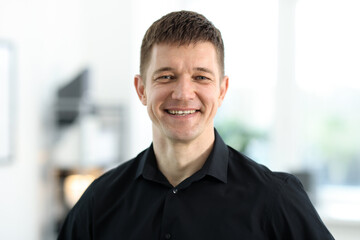 Obraz premium Portrait of handsome middle aged man indoors