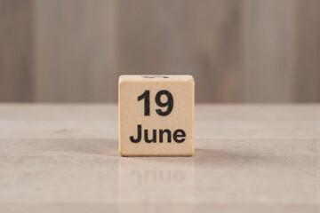 wooden block with the date 19 june on it