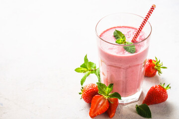 Strawberry smoothie or milkshake on white.
