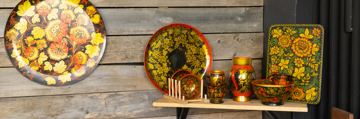 Traditional Russian Khokhloma painted woodenware set featuring plate bowl vase and cutting board...