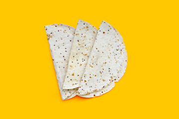 Quinoa tortilla wraps on yellow background